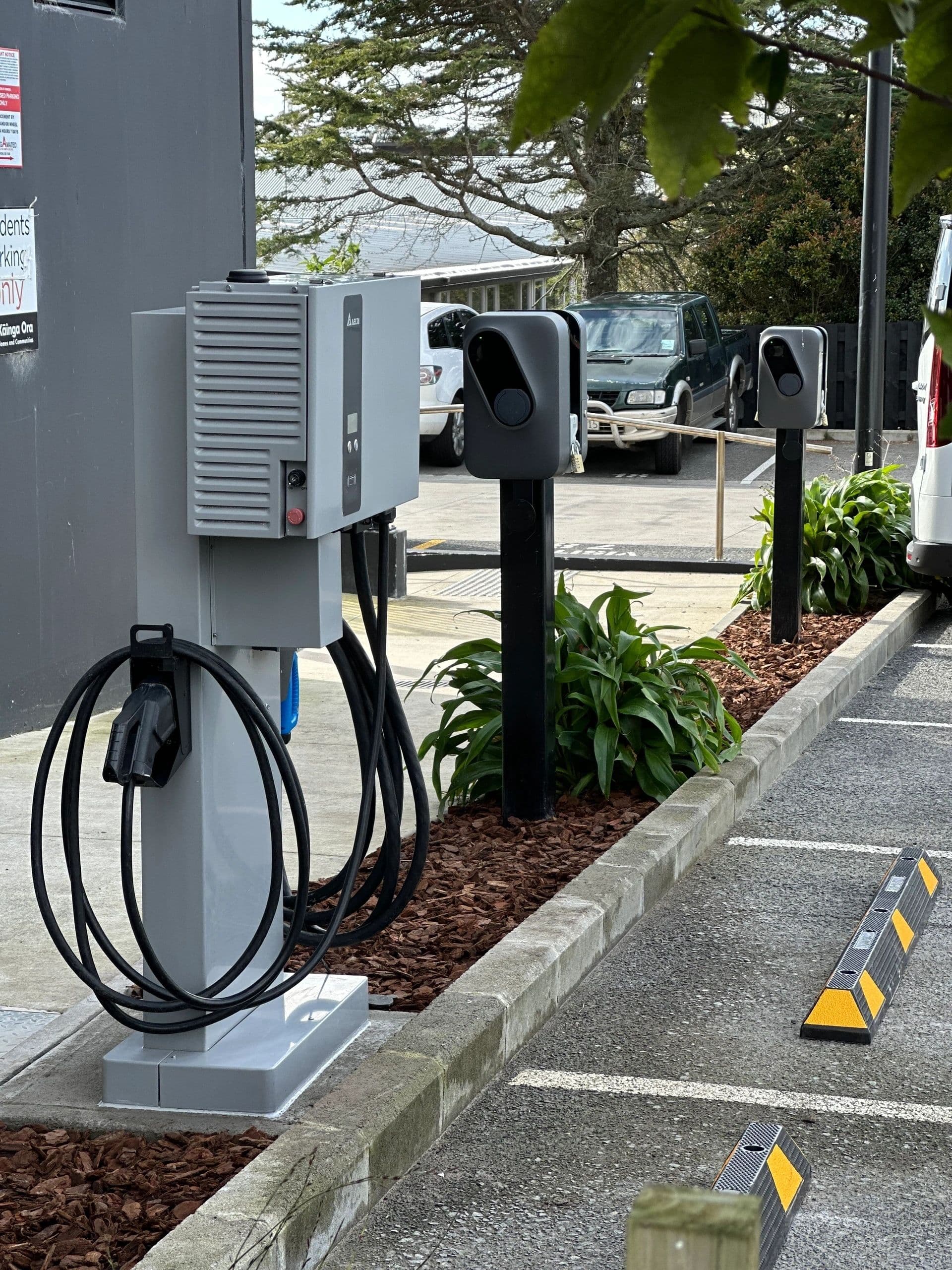 Public EV charging bays with pedestal chargers
